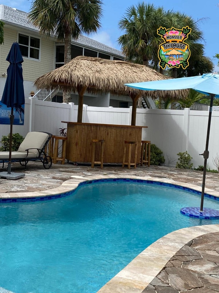 Poolside tiki bar with synthetic thatch roof